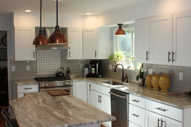 Kitchen - mid-sized modern kitchen idea in Denver with a single-bowl sink, white cabinets, marble countertops, gray backsplash, porcelain backsplash, stainless steel appliances, an island and white countertops