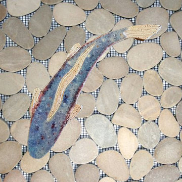 Tan / taupe, sliced pebble, rock, and stone shower with a blue Cutthroat trout