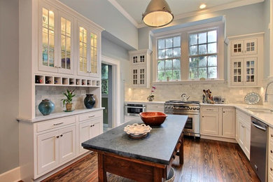 Enclosed kitchen - mid-sized transitional l-shaped dark wood floor and brown floor enclosed kitchen idea in Los Angeles with an undermount sink, shaker cabinets, white cabinets, marble countertops, gray backsplash, subway tile backsplash, stainless steel appliances, an island and gray countertops