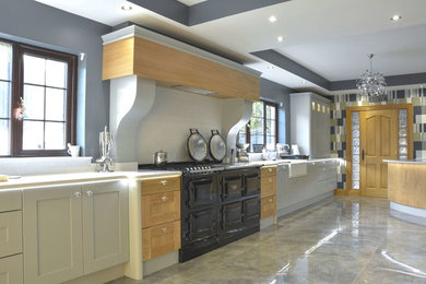 Photo of a traditional open plan kitchen in Other with a belfast sink, shaker cabinets, grey cabinets, quartz worktops and a breakfast bar.
