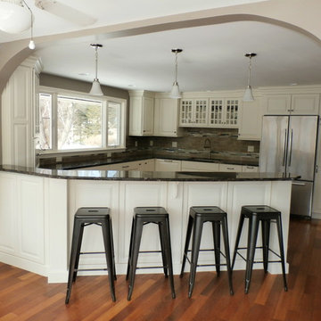 Traditional White Kitchen Remodel with Cook top in the peninsula