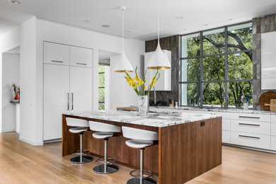 Example of a trendy kitchen design in Austin with an island