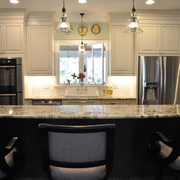 Brush-stroke painted kitchen with red brick floor