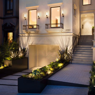 This is an example of a transitional front yard partial sun garden in San Francisco with a garden path and brick pavers.