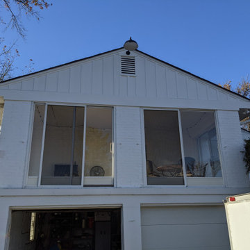 Board and Batton siding on an older brick home