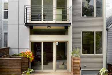 Photo of a mid-sized contemporary two-storey grey house exterior in San Francisco with mixed siding and a flat roof.