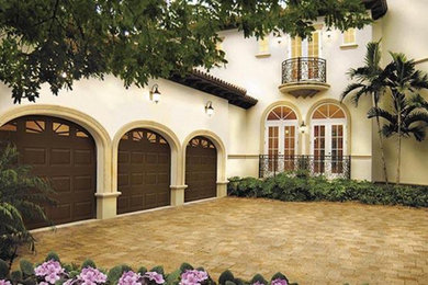 Large tuscan attached three-car carport photo in Calgary