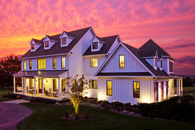 Cottage white house exterior photo in DC Metro with a mixed material roof