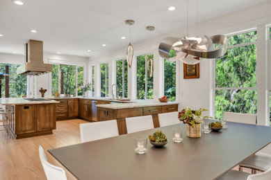 Example of a large transitional light wood floor and beige floor great room design in Portland with white walls