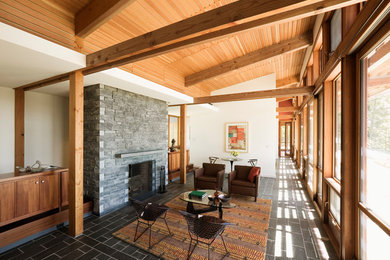 Inspiration for a mid-sized midcentury formal open concept living room in Bridgeport with a standard fireplace, a stone fireplace surround, white walls, slate floors and no tv.