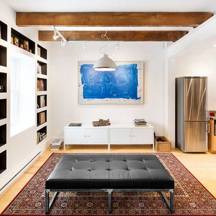 Photo of a medium sized scandi basement in San Francisco with blue walls, bamboo flooring, no fireplace and a brick fireplace surround.