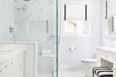 Inspiration for a mid-sized transitional master bathroom in Toronto with shaker cabinets, white cabinets, a corner shower, a one-piece toilet, blue tile, porcelain tile, blue walls, porcelain floors, an undermount sink, engineered quartz benchtops, a hinged shower door, white benchtops and white floor.