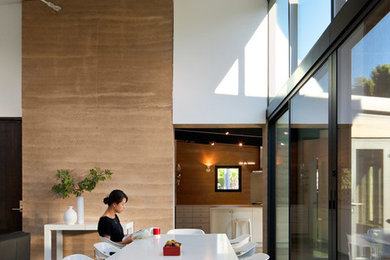 Inspiration for a mid-sized contemporary open plan dining in San Francisco with concrete floors and no fireplace.