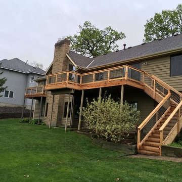 Cedar toned pressure treated deck with aluminum balusters