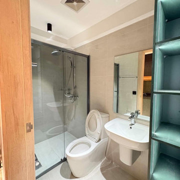 Modern Condo Bathroom with Glass Shower Enclosure