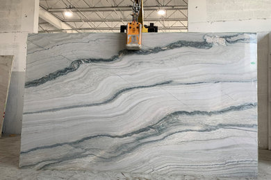 Inspiration for an eat-in kitchen remodel in Miami with quartzite countertops, an island and blue countertops