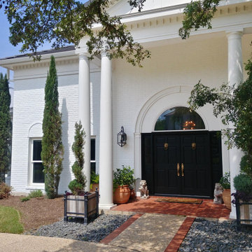Grand Home with White Painted Brick Exterior