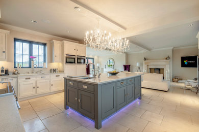 Contemporary kitchen in Cheshire with an integrated sink and feature lighting.