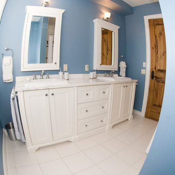 Blue Bathroom with A Double Vanity and Twin Medicine Cabinets