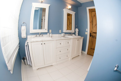 Blue Bathroom with A Double Vanity and Twin Medicine Cabinets