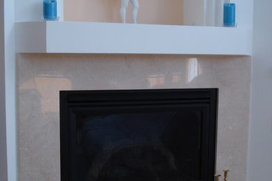 Inspiration for a large timeless formal marble floor living room remodel in San Diego with white walls, a corner fireplace and a stone fireplace