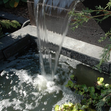 Raised railway sleeper water feature and pool