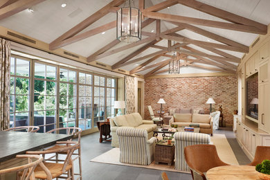 Inspiration for a large country open concept slate floor and gray floor family room remodel in Houston with red walls, no fireplace and a media wall