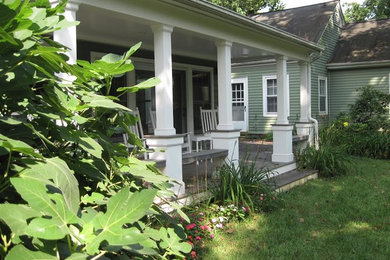 Mid-sized classic back porch idea in Richmond with decking and a roof extension