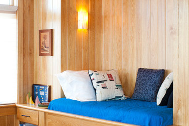 Inspiration for a mid-sized craftsman light wood floor hallway remodel in Richmond with beige walls