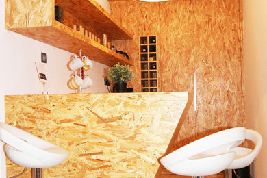 Inspiration for an industrial l-shaped marble floor kitchen remodel in Other with a double-bowl sink, beaded inset cabinets, medium tone wood cabinets, wood countertops and an island