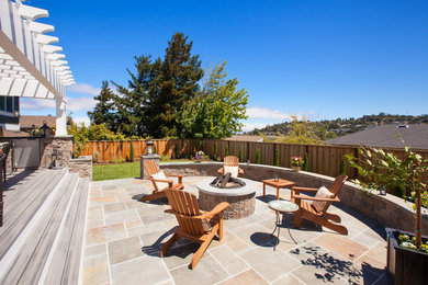 Inspiration for a mid-sized arts and crafts backyard patio in San Francisco with a fire feature and tile.