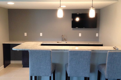 Inspiration for a contemporary home bar remodel in Other