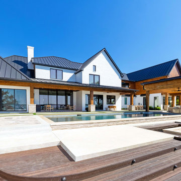 Waterfront deck with pool featuring Rustic Walnut composite decking