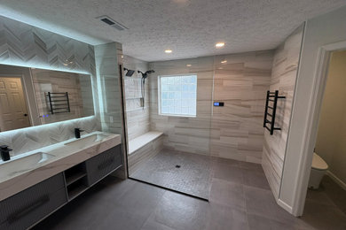 Mid-sized minimalist master white tile and porcelain tile cement tile floor, gray floor and double-sink bathroom photo in Columbus with beaded inset cabinets, turquoise cabinets, a bidet, gray walls, an undermount sink, onyx countertops, white countertops, a niche and a floating vanity