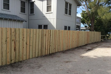 This is an example of a mid-sized side yard gravel landscaping in Tampa.
