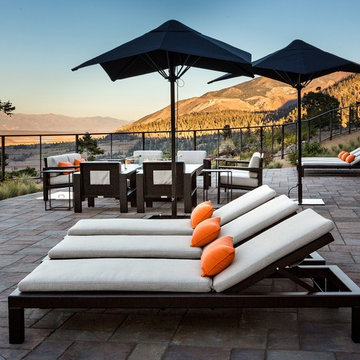 Mammoth Chaise Lounge and Umbrella with fire pit seating arrangement.