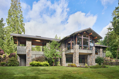 Large rustic multicolored two-story mixed siding house exterior idea in Seattle with a metal roof