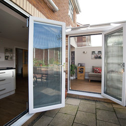 White Conservatory with PVCu Bi-Fold Doors - Products