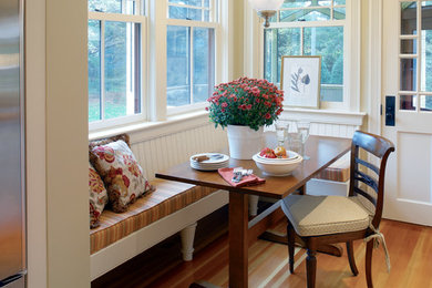Kitchen/dining room combo - victorian medium tone wood floor kitchen/dining room combo idea in Providence with beige walls