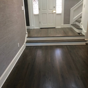 Red oak - 2 1/4" stained with custom grey stain and finished with waterbase