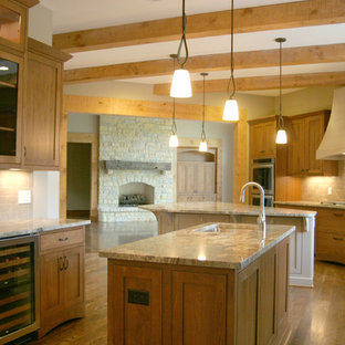 Huge craftsman kitchen pantry ideas - Kitchen pantry - huge craftsman u-shaped medium tone wood floor kitchen pantry idea in Cincinnati with medium tone wood cabinets, granite countertops, beige backsplash, stainless steel appliances, two islands, an undermount sink, shaker cabinets and ceramic backsplash