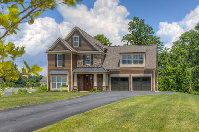 Inspiration for a mid-sized craftsman brown two-story mixed siding exterior home remodel in Other