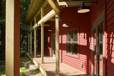 Example of a country exterior home design in New York