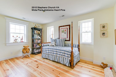 This is an example of a traditional bedroom in Raleigh.