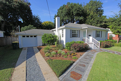 Inspiration for a small timeless white one-story brick house exterior remodel in Jacksonville