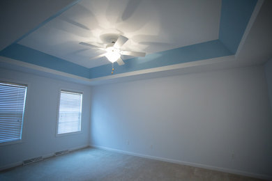 Bedroom with Accented Ceiling
