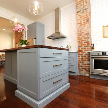 Open shelving and exposed brick are among the many details that encompass the si