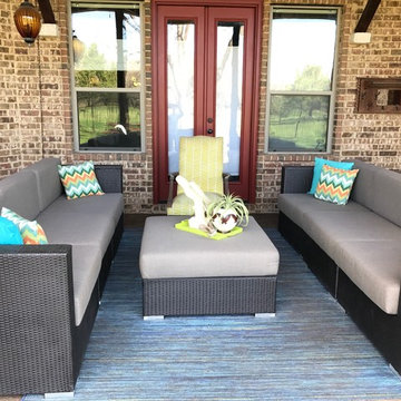 Patio space grounded with neutral Sunbrella Sailcloth Shadow cushions