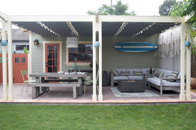 Small beach style detached one-car garage photo in Santa Barbara