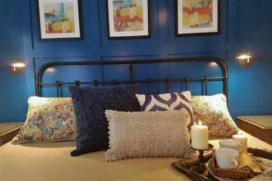 Mid-sized transitional master carpeted and beige floor bedroom photo in Other with blue walls